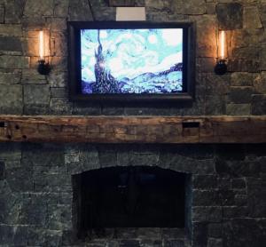 Framed Flat Screen TV above mantel - Talie Jane Interiors