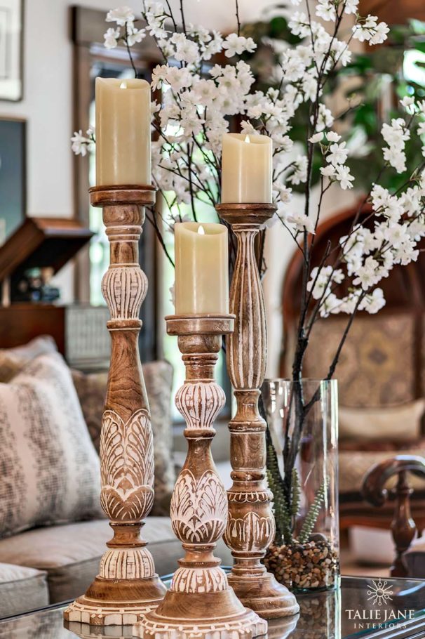The close-up view of stone-cut candle stands and glass flower vase