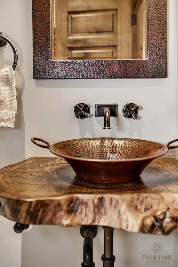The copper bathroom mirror, basin, and bathroom fittings